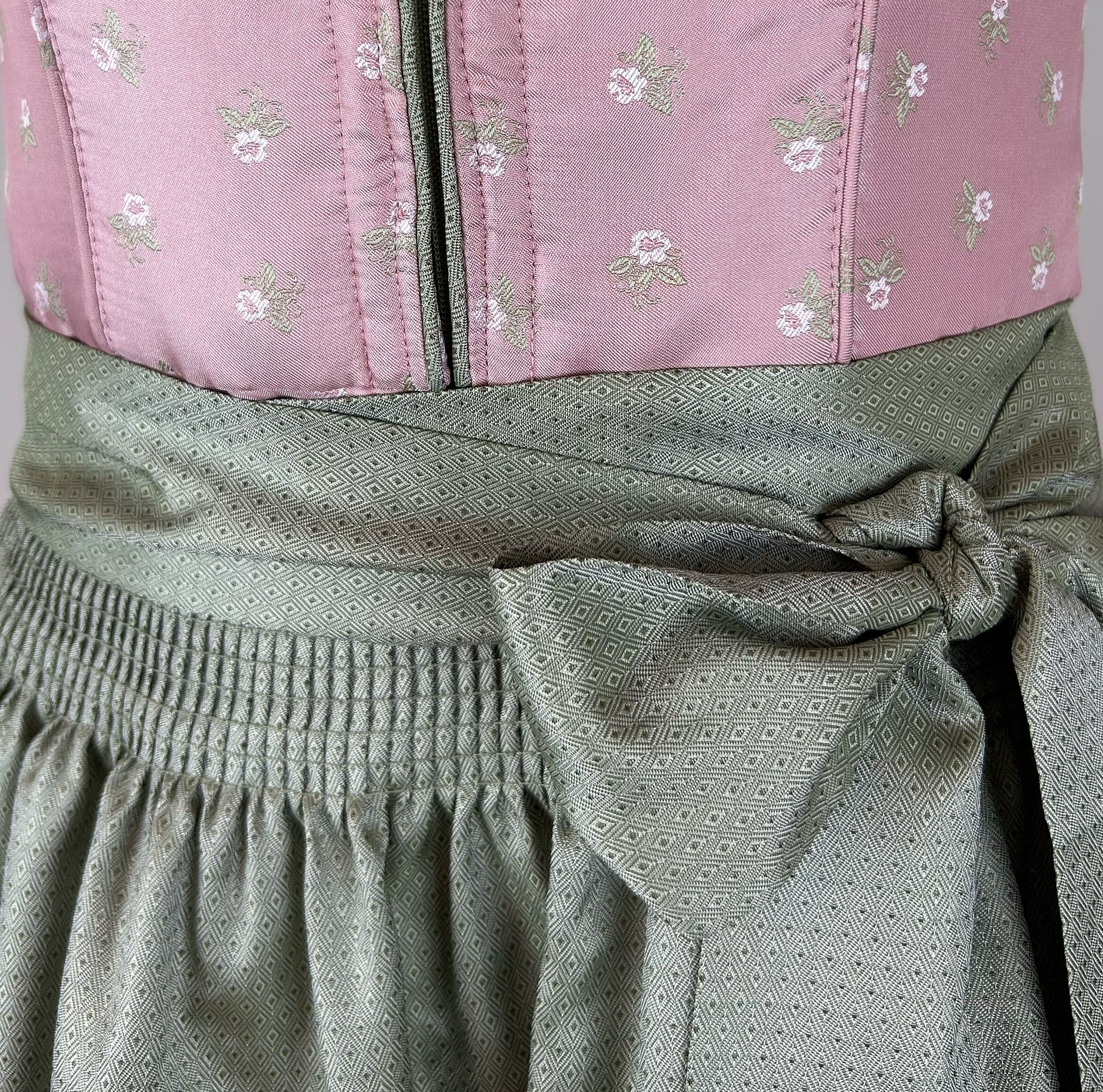 Affordable dirndl dress rental in Munich or online. Rent the elegant Krüger Dirndl Merida in pink—perfect for Oktoberfest and events. Book your dirndl cheap today!