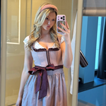 A women wearing a rented Krüger Dirndl from Versatile OTM. Traditional German Oktoberfest Dirndl as a mirror selfie