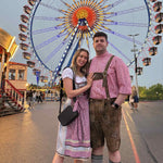 A couple posing in traditional Bavarian Oktoberfest Outfits for Oktoberfest rented Dirndl from Versatile OTM 