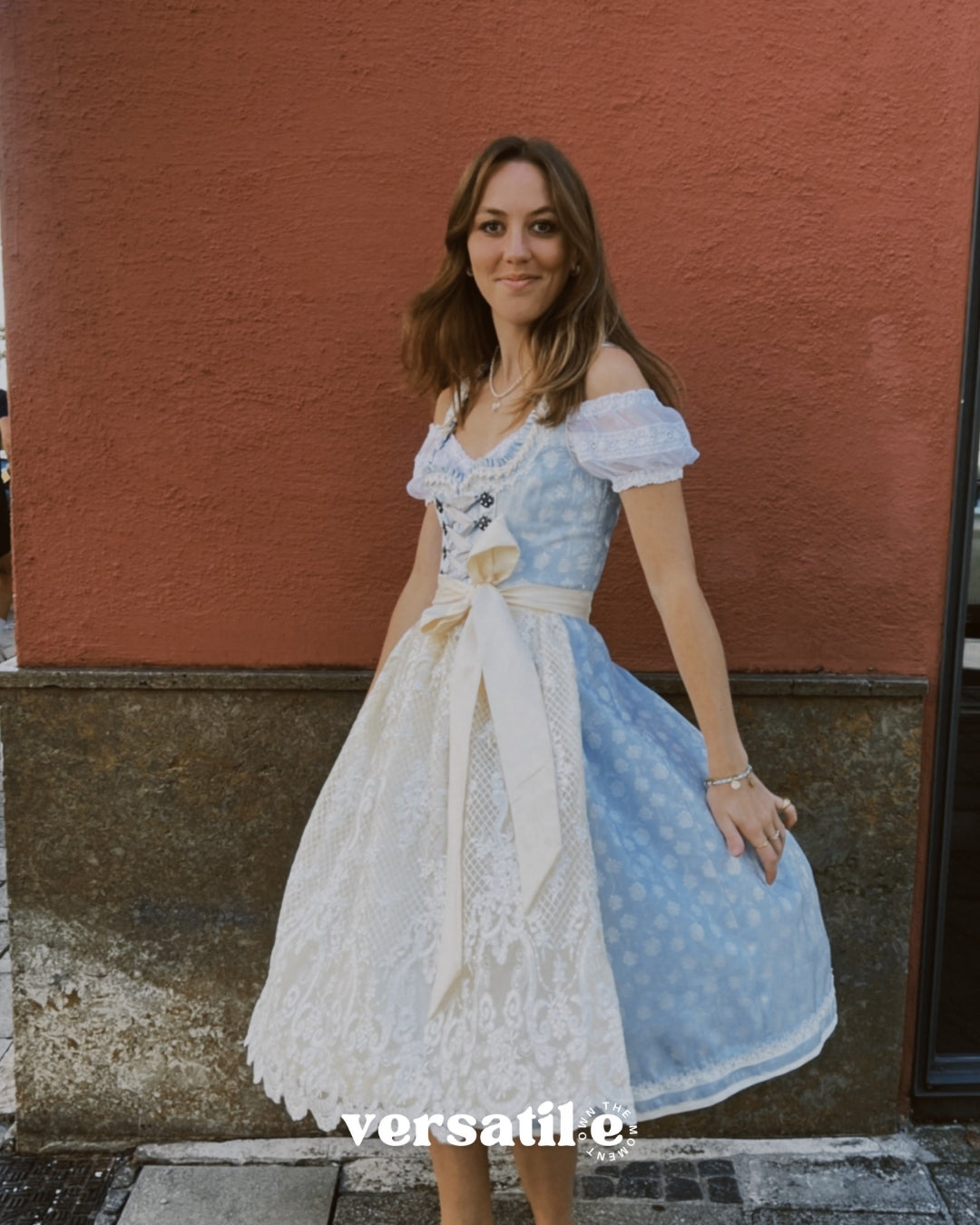 Munich Oktoberfest rental: Krüger Maylin dirndl with pastel blue heart neckline, lace apron, 70 cm midi skirt, and practical pockets.