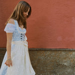 Rent Krüger Dirndl Maylin in Munich: elegant blue midi dress with lace apron, front zipper, side pockets, and flattering fit—Oktoberfest ready.