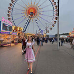A girl with rented Dirndl posing in traditional Bavarian Oktoberfest Outfits Krueger Light Blue Dirndl for Oktoberfest rented Dirndl from Versatile OTM 