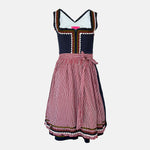 Traditional dirndl rental via Versatile, navy bodice with dotted fabric, red gingham apron, embroidered hem; Bavarian Oktoberfest outfit
