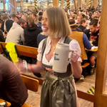Girl wearing a traditional Krüger Drindl rented for Oktoberfest through Versatile OTM rental.