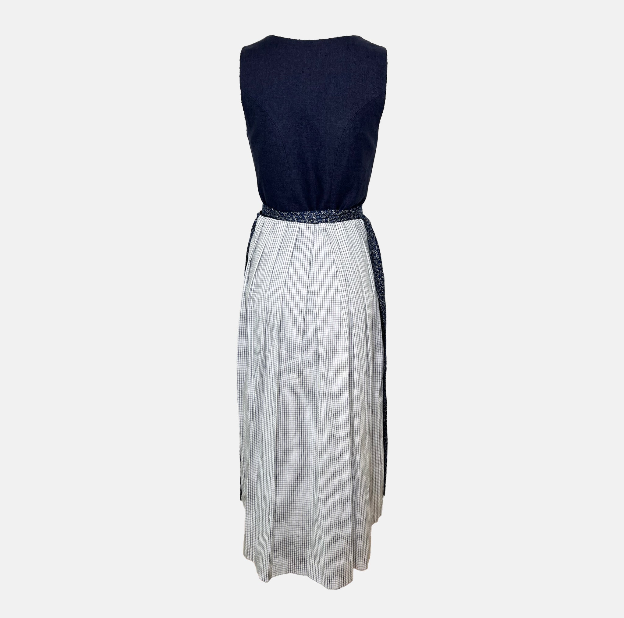 Traditional blue Ludwig & Therese Dirndl with buttoned bodice and patterned apron, available for rent at Versatile OTM.