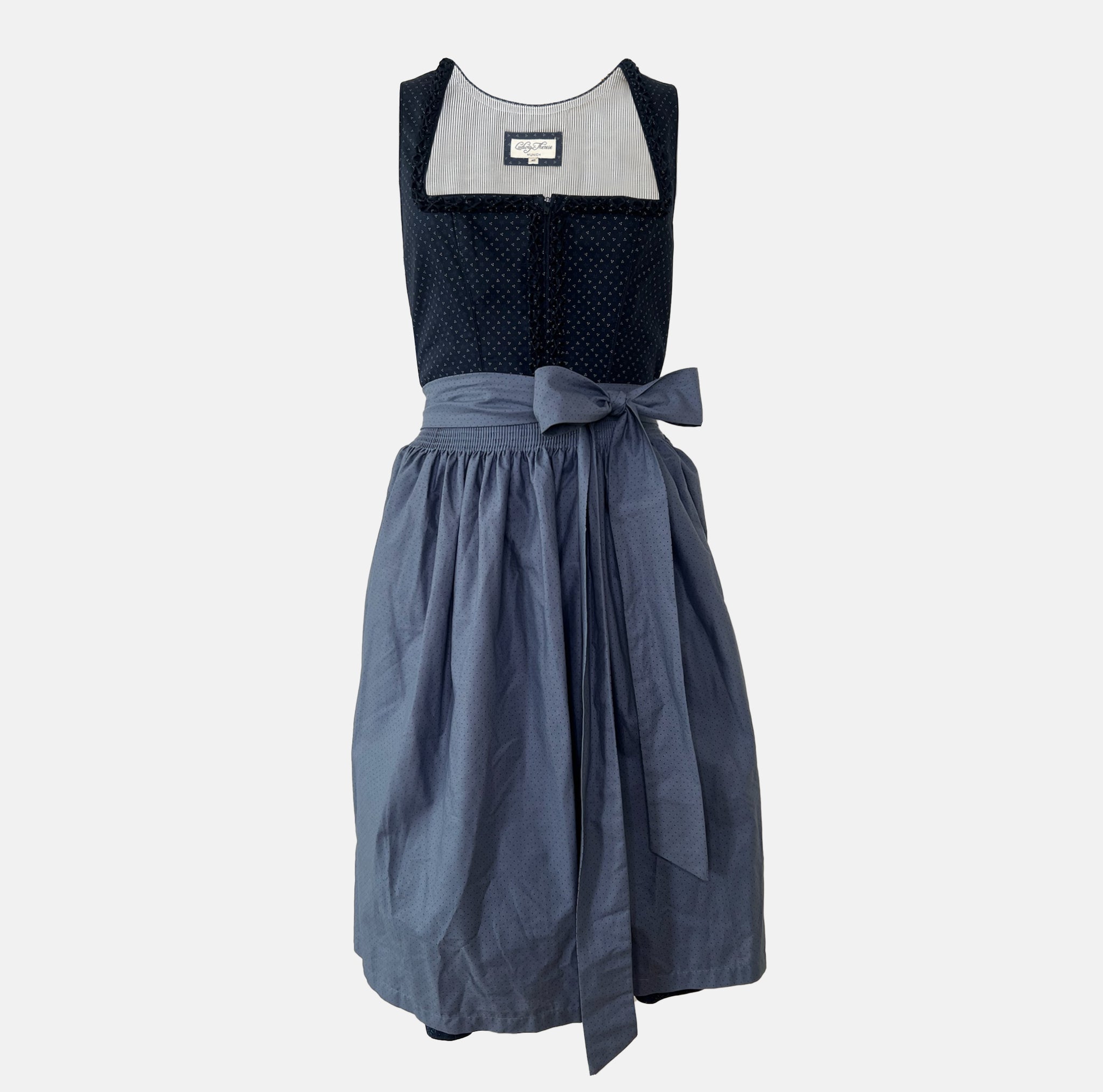 Traditional blue Ludwig & Therese dirndl with patterned bodice and light blue apron, available for rent at Versatile OTM.