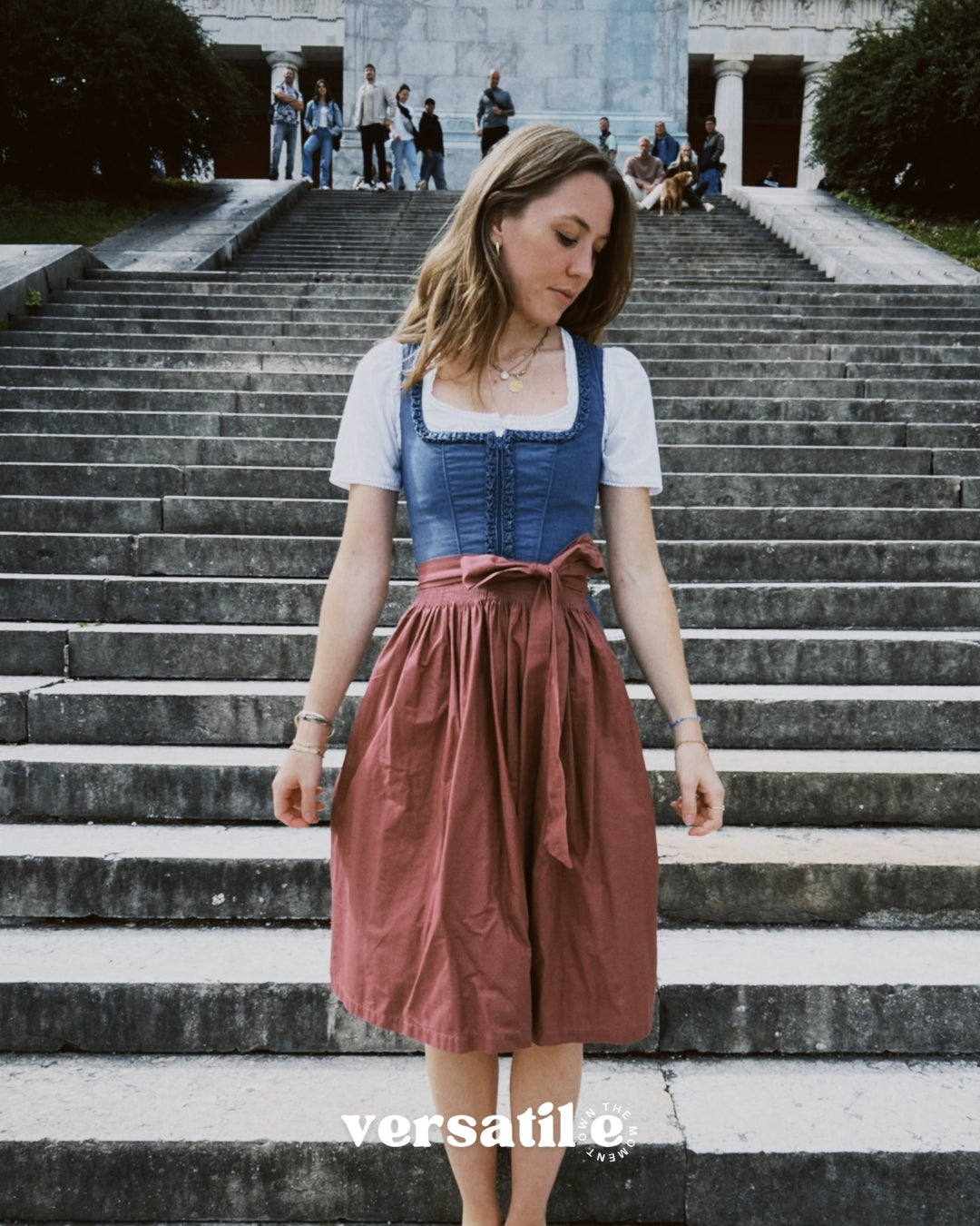 Oktoberfest-ready Ludwig & Therese dirndl—baby blue bodice, pink apron, hidden front zipper, 60 cm skirt; available for rental in Munich.