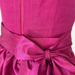 Rent Ma.le.ma dirndl dress – artisanal handmade dirndl from Munich in bold pink with matching apron; rental dirndl for Oktoberfest