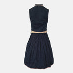 Marjo Bavarian rental dirndl with navy dotted button-front bodice and beige patterned apron, available at Versatile OTM in Munich.