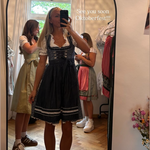 A girl taking a mirror selfie at Versatile OTM wearing the Marjo Domenica Rented Dirndl for Oktoberfest 