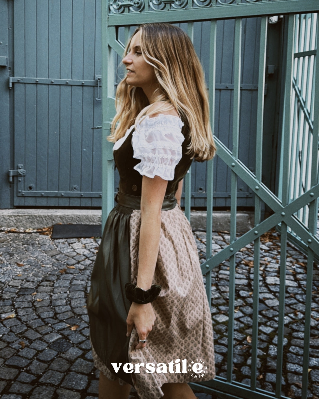 Olive velvet MarJo dirndl with sweetheart neckline, gold hardware, and subtle beige-patterned hem—available for Oktoberfest dress rental in Munich.