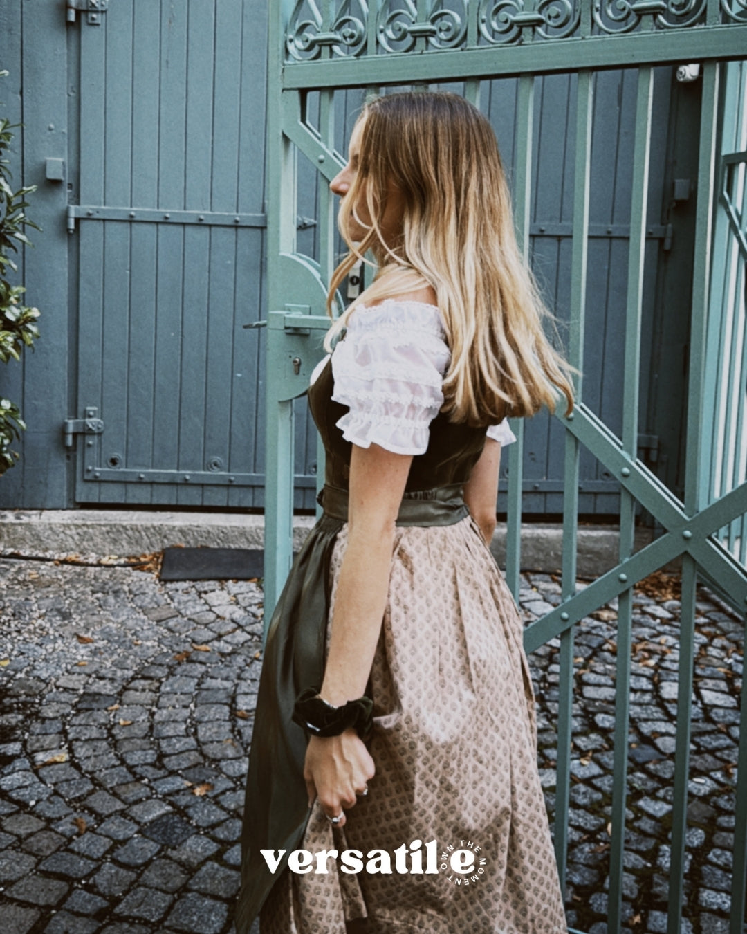 Oktoberfest rental: MarJo olive velvet dirndl in Munich with v-neck bodice, gold accents, and elegant beige hem—Versatile OTM.