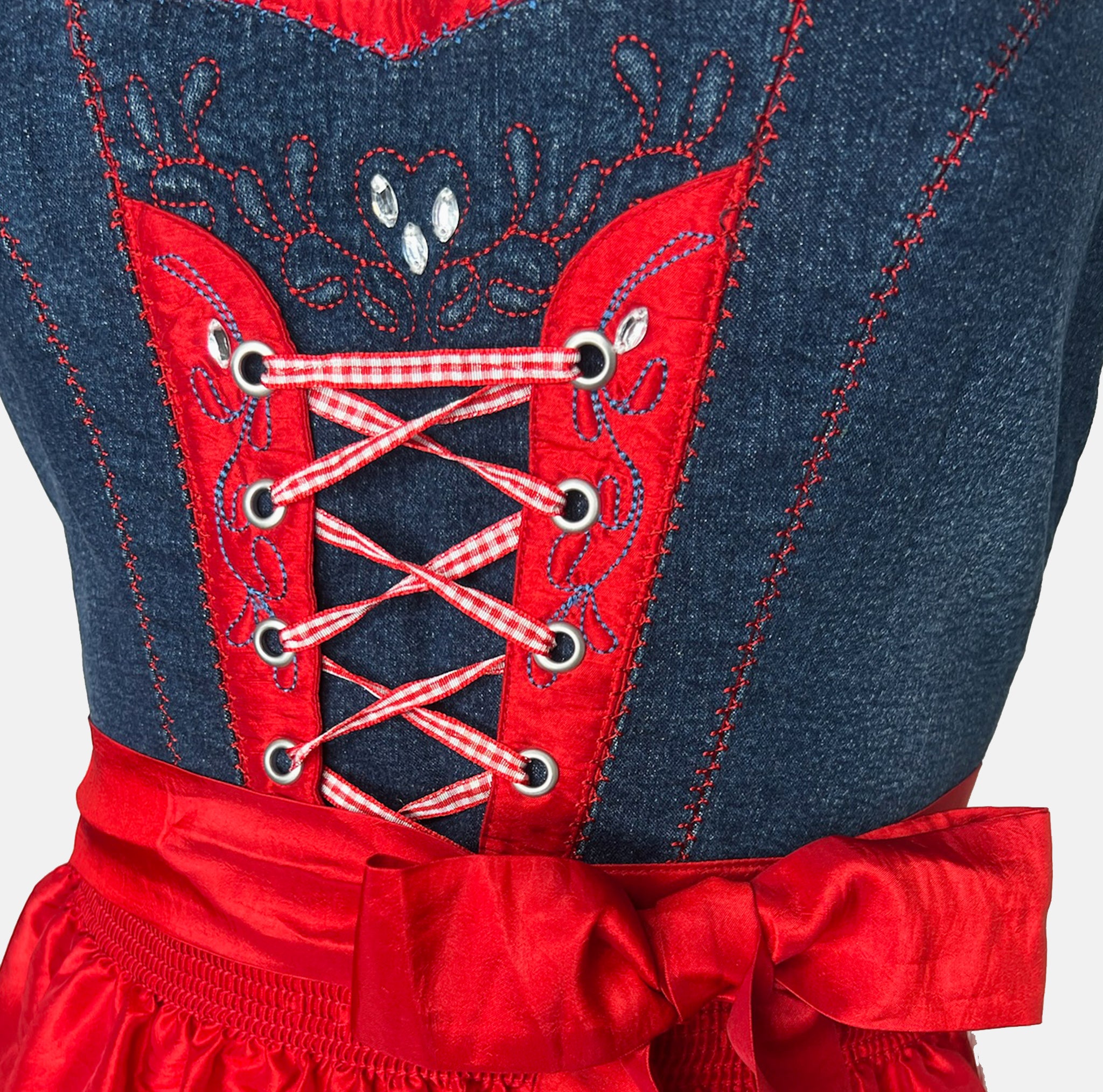 Cheeky red and navy dirndl with gingham bodice, lace-up detail, and red satin apron, available for rental at Versatile OTM, owned by Beer&Pretzel Tours