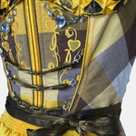Yellow and brown cheeky dirndl with embroidered bodice and golden apron, available for rental at Versatile OTM, owned by Beer&Pretzel Tours.