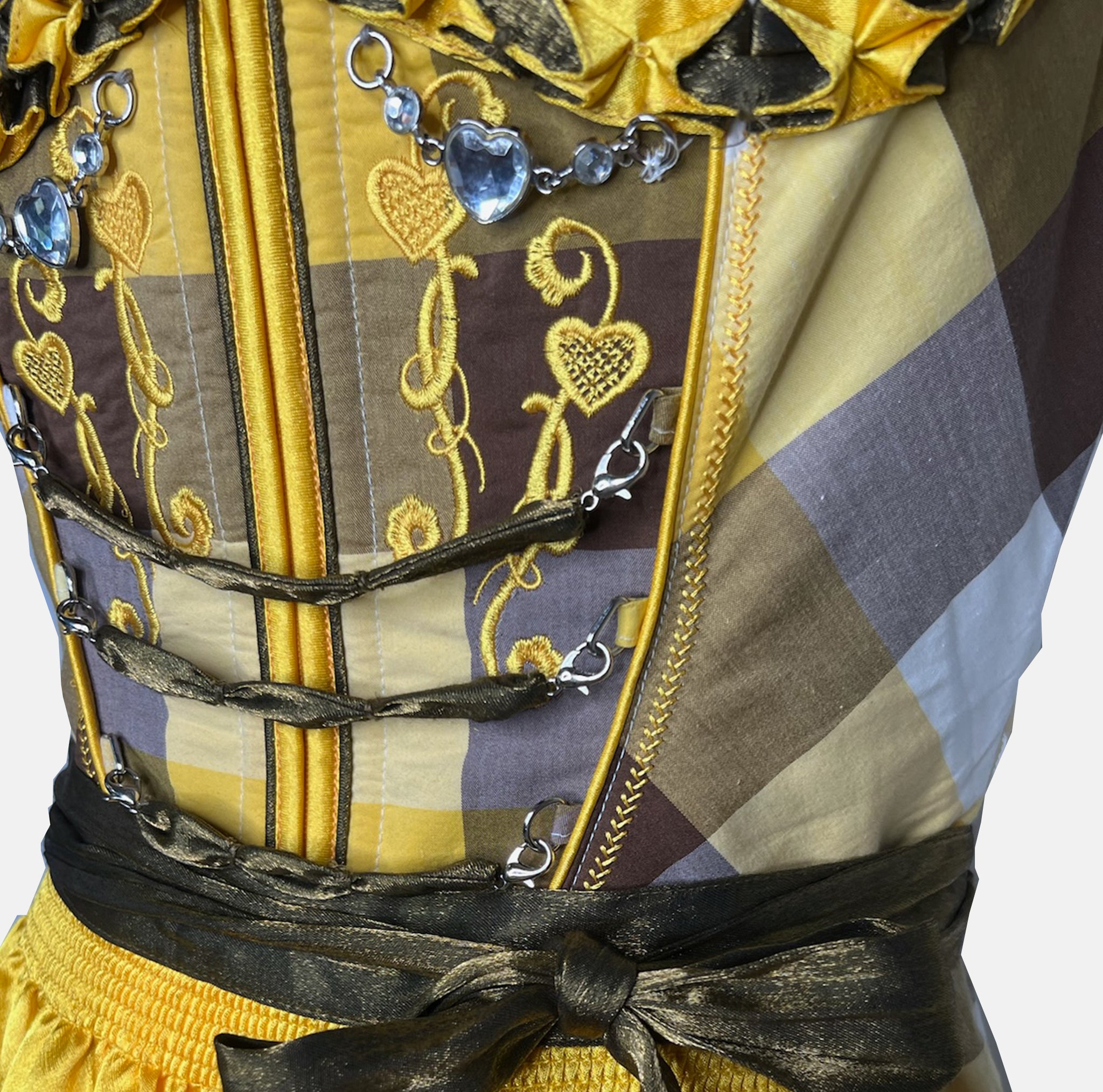 Yellow and brown cheeky dirndl with embroidered bodice and golden apron, available for rental at Versatile OTM, owned by Beer&Pretzel Tours.