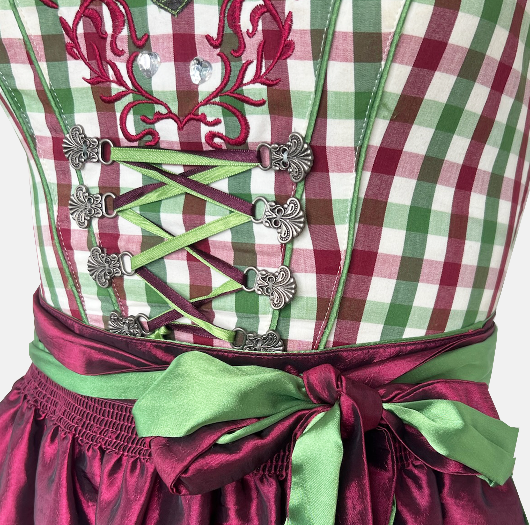 Rent a Bavarian dirndl dress in Munich with green checkered bodice and burgundy apron. Perfect Oktoberfest outfit rental at Versatile OTM.