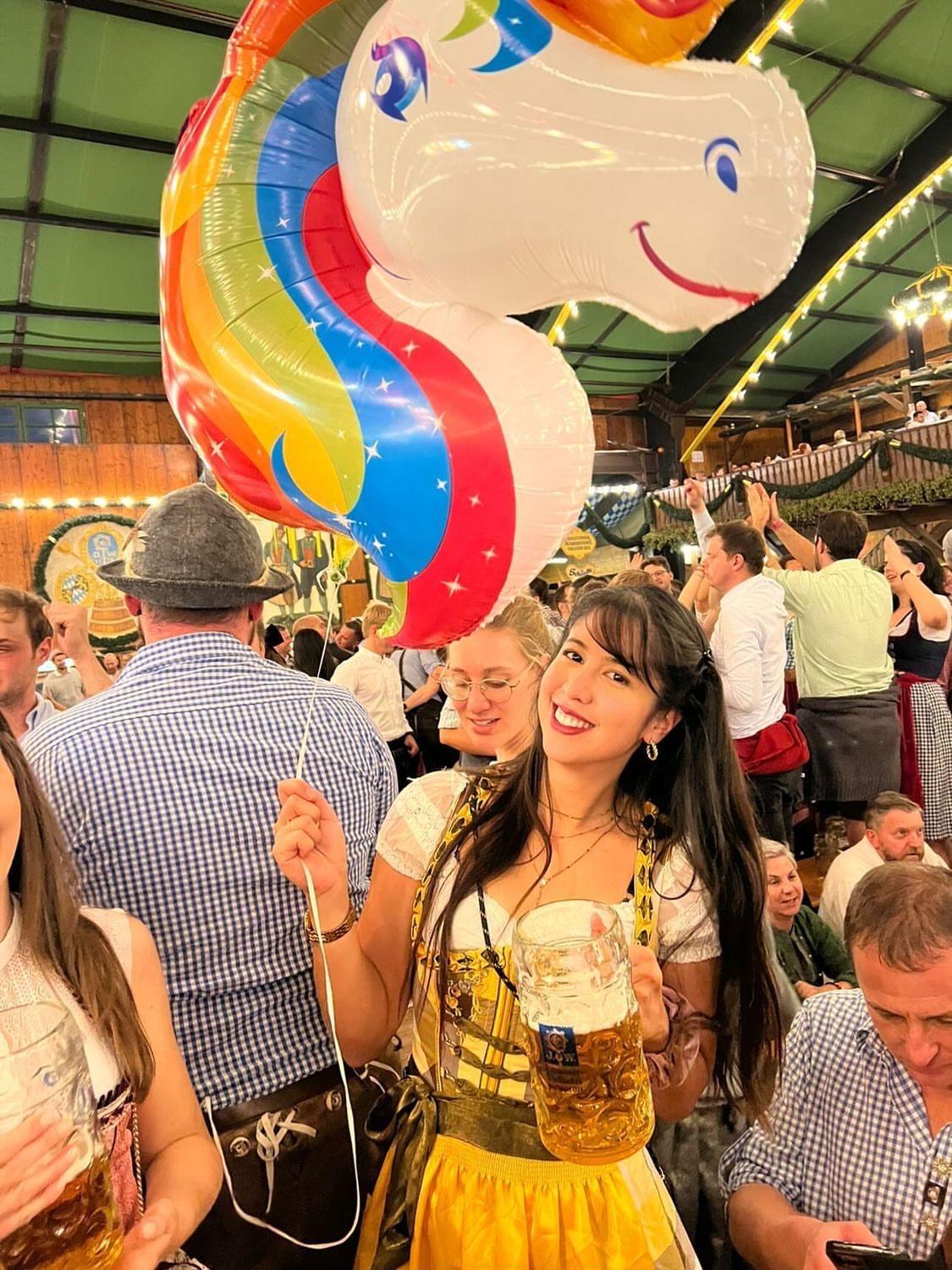 Yellow and brown cheeky dirndl with embroidered bodice and golden apron, available for rental at Versatile OTM, owned by Beer&Pretzel Tours.