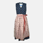 Trachtenmanufaktur Bavarian rental dirndl with navy floral bodice and rose embroidered apron, available at Versatile OTM in Munich, owned by Beer&Pretzel Tours.