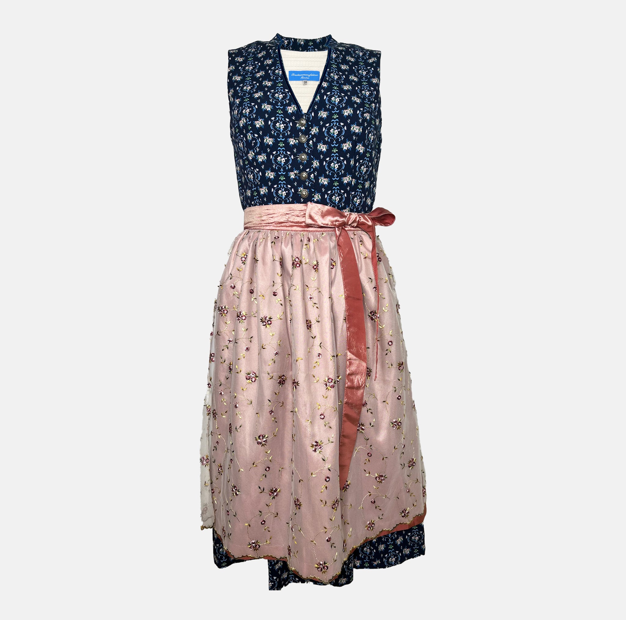 Trachtenmanufaktur Bavarian rental dirndl with navy floral bodice and rose embroidered apron, available at Versatile OTM in Munich, owned by Beer&Pretzel Tours.
