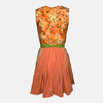 Tramontana Bavarian rental dirndl with orange embroidered satin bodice and green embroidered apron, available at Versatile OTM in Munich.
