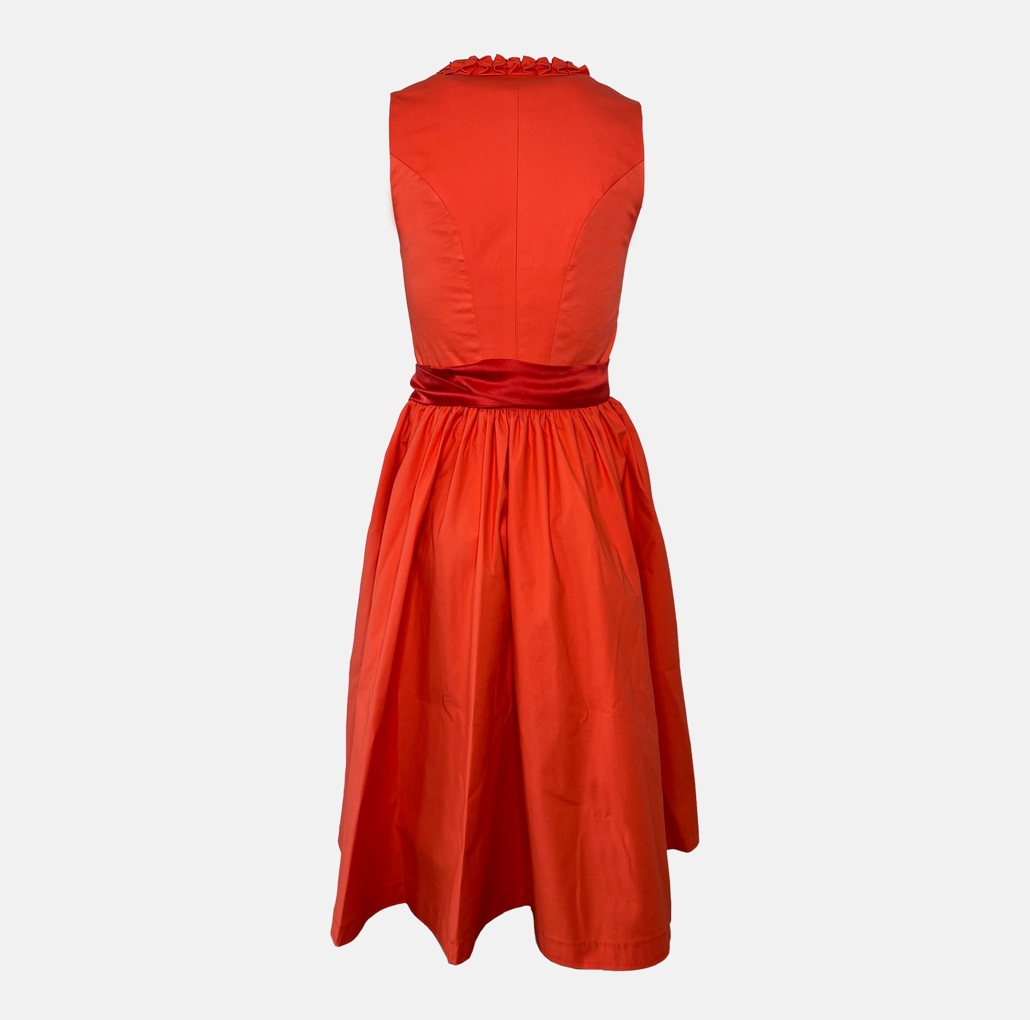 Handmade red Versatile Collection Dirndl with tone-in-tone bodice and apron – modern, elegant, and available to rent at Versatile OTM.