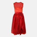 Handmade red Versatile Collection Dirndl with tone-in-tone bodice and apron – modern, elegant, and available to rent at Versatile OTM.