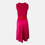 Elegant red Versatile Collection Dirndl with tone-on-tone design, handmade in Germany — perfect for Oktoberfest and available to rent at Versatile OTM.