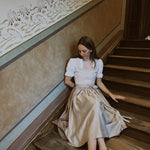 Minimalistic Christine Versatile Collection dirndl in light taupe with pleated neckline and A-line skirt – premium Oktoberfest rental in Munich.
