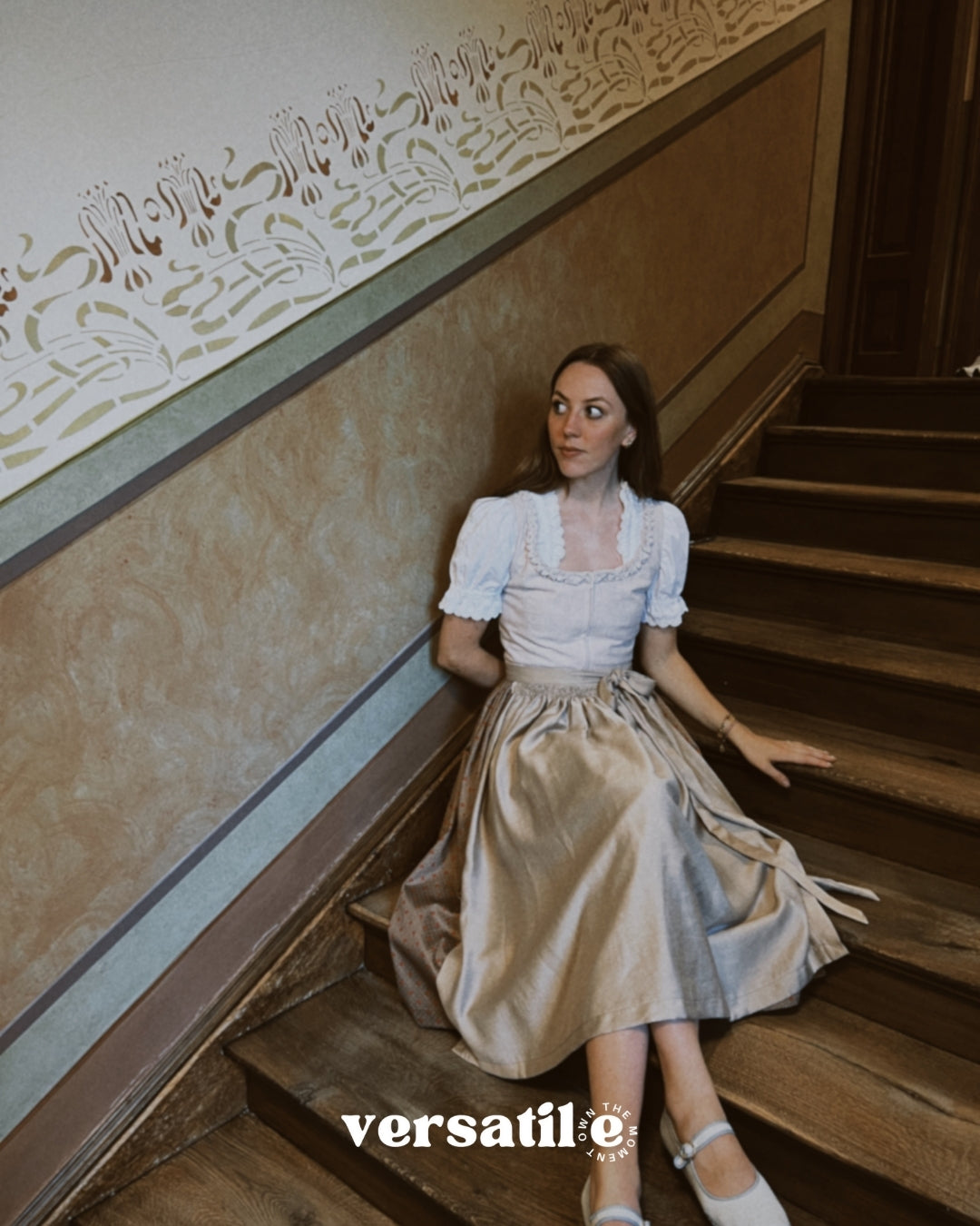 Handcrafted Munich rental dirndl Christine, light taupe textured bodice with pleated round neckline and flowing 70 cm skirt—ideal for Oktoberfest.