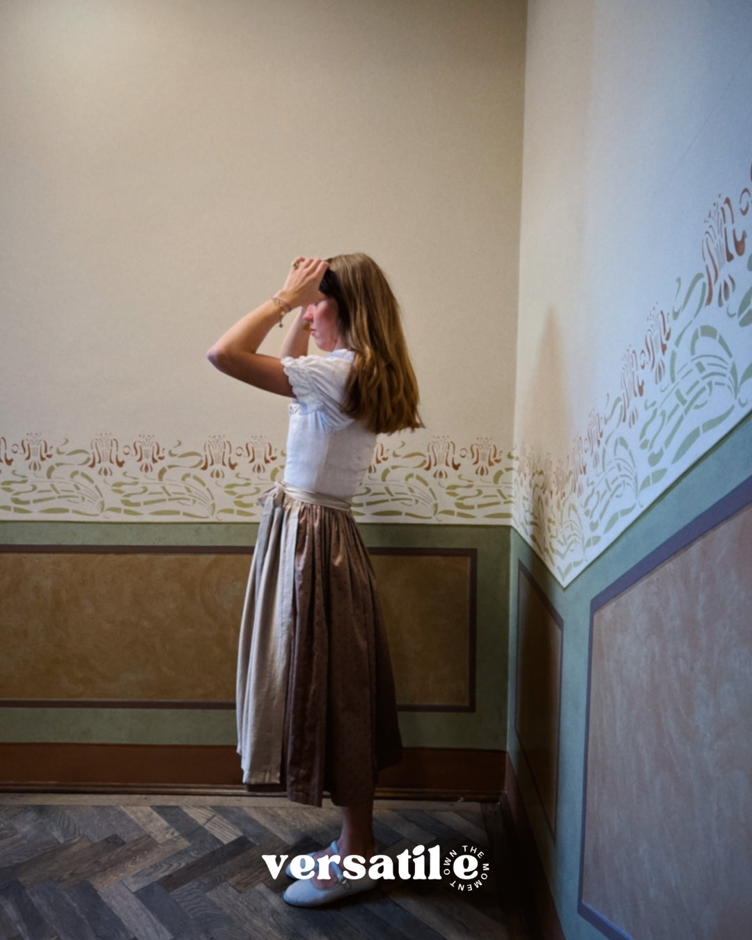 Versatile Collection Dirndl Christine: elegant light taupe linen dress with pleated neckline and tailored A-line cut, available for Oktoberfest rental in Munich.
