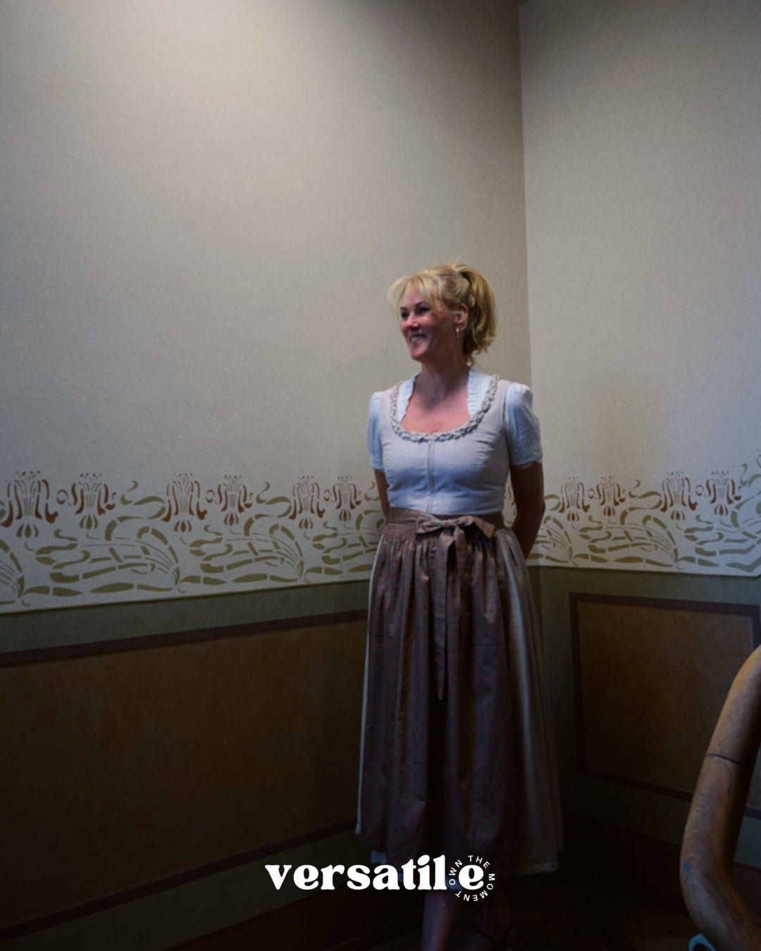 Minimalistic Christine Versatile Collection dirndl in light taupe with pleated neckline and A-line skirt – premium Oktoberfest rental in Munich.