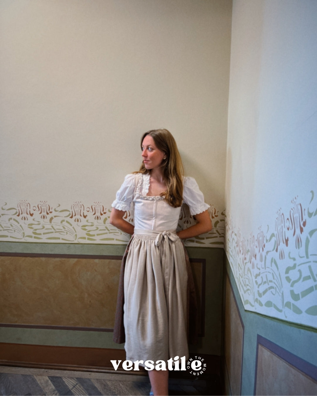 Oktoberfest rental: Dirndl Christine in light taupe, pleated neckline detail and flowing skirt, handmade in Germany by Versatile OTM.