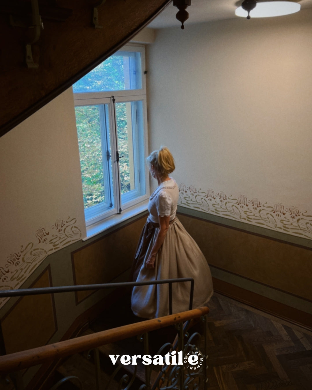 Handcrafted Munich rental dirndl Christine, light taupe textured bodice with pleated round neckline and flowing 70 cm skirt—ideal for Oktoberfest.