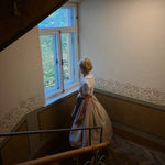 Handcrafted Munich rental dirndl Christine, light taupe textured bodice with pleated round neckline and flowing 70 cm skirt—ideal for Oktoberfest.