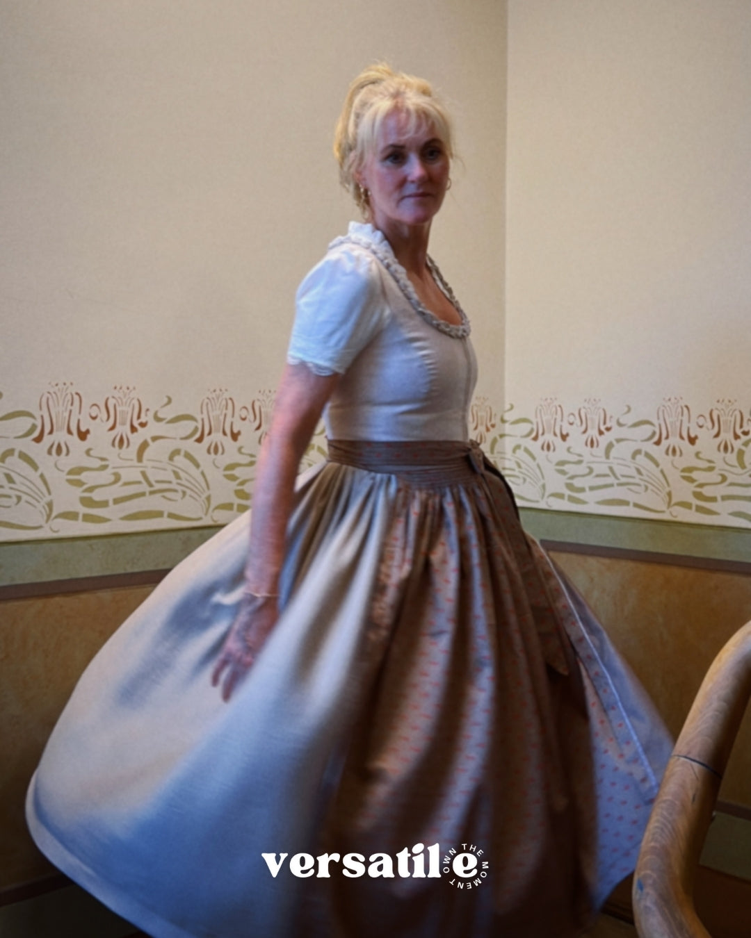 Rent Dirndl Christine in Munich: refined Versatile Collection dirndl with light taupe linen, pleated front, and flattering 70 cm skirt—Oktoberfest ready.