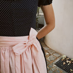Rent premium Dirndl in Munich: Versatile Collection dress with vintage-inspired navy bodice and pale pink apron for Oktoberfest.