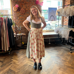 Girl wearing the rented Versatile Collection Dirndl Valerie rented on Versatile OTM for Oktoberfest