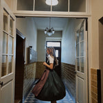 Elegant Versatile Dirndl Mia—green mini-floral bodice, rich plum linen apron with bow sash, 70 cm skirt handcrafted in Germany for Oktoberfest rentals.