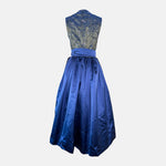 A royal blue traditional dirndl dress with a patterned bodice, lace skirt, and a silky blue ribbon. Rent your Dirndl for Oktoberfest as stunning as this Dirndl