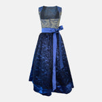 A royal blue traditional dirndl dress with a patterned bodice, lace skirt, and a silky blue ribbon. Rent your Dirndl for Oktoberfest as stunning as this Dirndl
