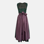Rent this unique handmade green Versatile dirndl with a plum apron from our Munich collection. Perfect for Oktoberfest or elegant events. Available online or in-store.