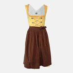 Traditional Watzmann Trachten Dirndl with a yellow bodice, brown patterned skirt, and ribbon detail – available for rent at Versatile OTM.