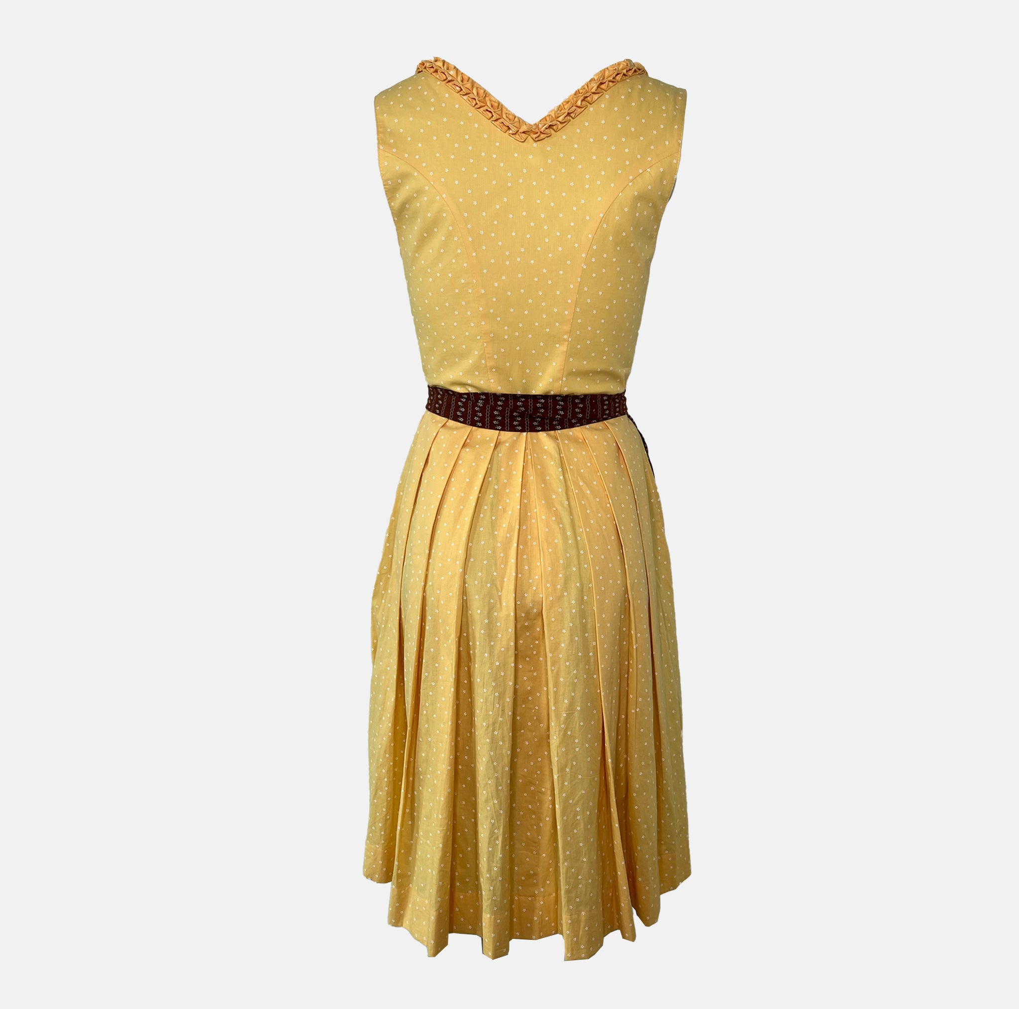 Traditional Watzmann Trachten Dirndl with a yellow bodice, brown patterned skirt, and ribbon detail – available for rent at Versatile OTM.