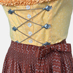 Traditional Watzmann Trachten Dirndl with a yellow bodice, brown patterned skirt, and ribbon detail – available for rent at Versatile OTM.