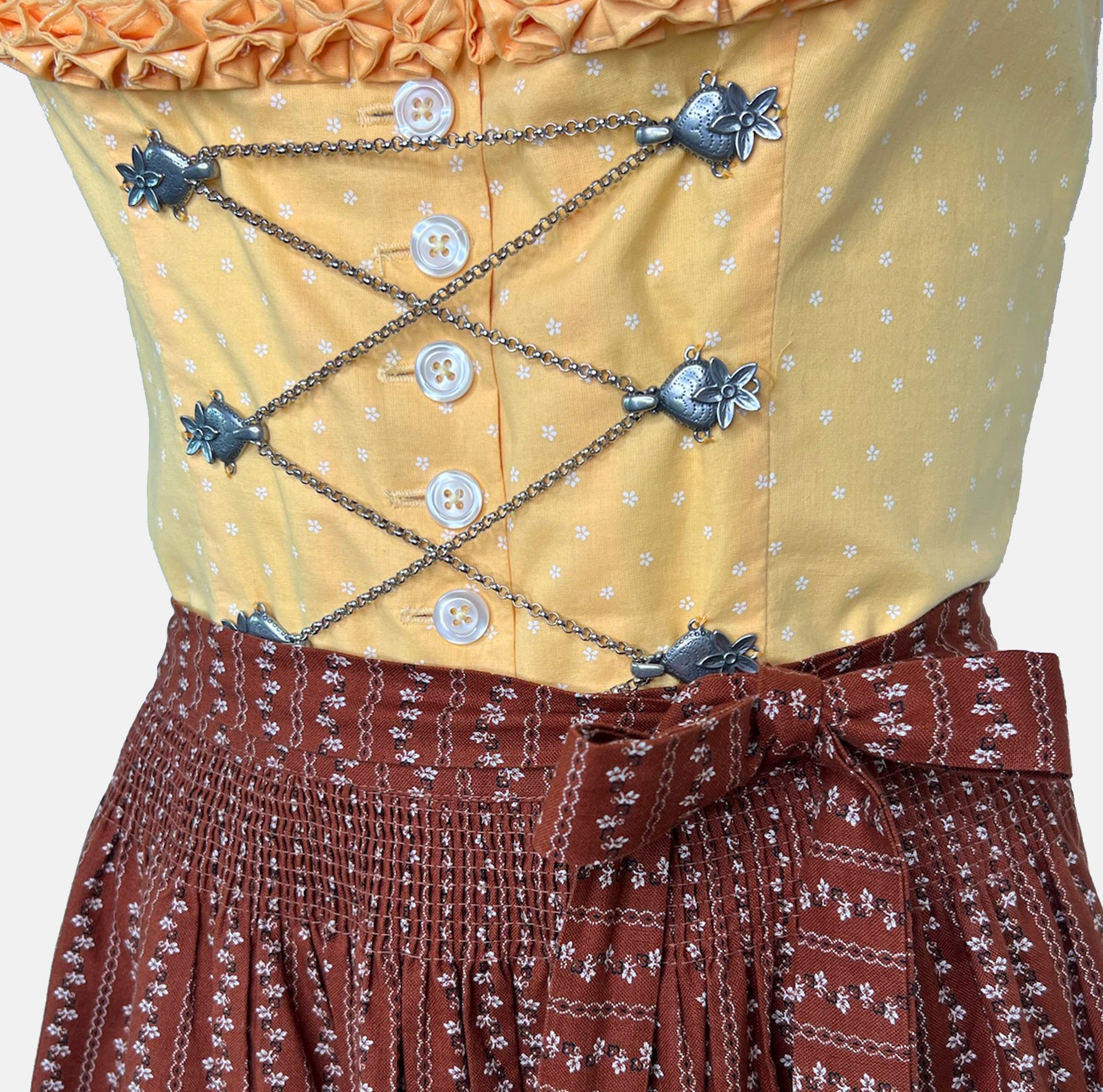 Traditional Watzmann Trachten Dirndl with a yellow bodice, brown patterned skirt, and ribbon detail – available for rent at Versatile OTM.