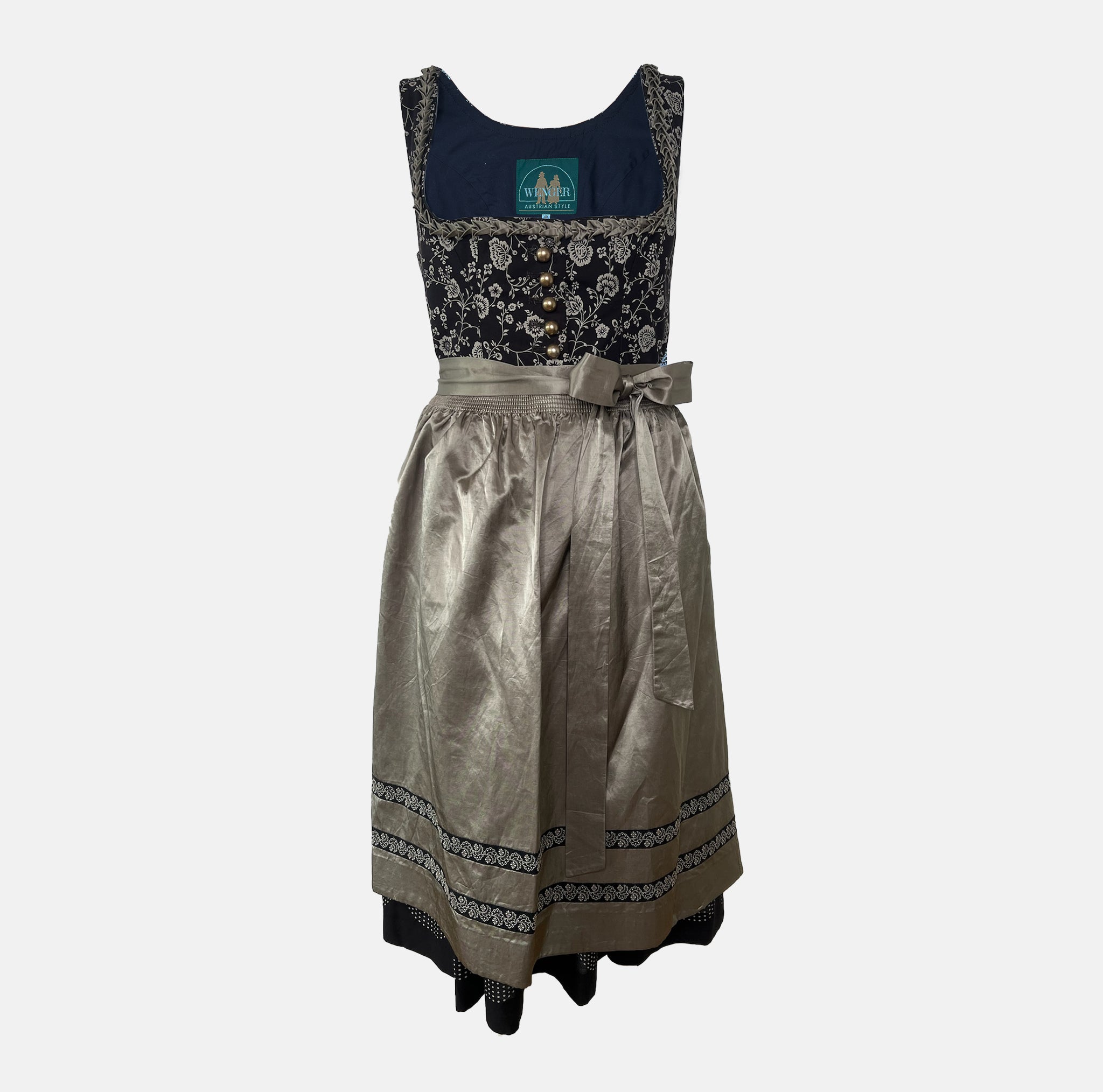 Elegant traditional Wenger Dirndl with floral embroidery and satin apron – available to rent via Versatile for Oktoberfest or festive events.