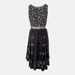 Elegant traditional Wenger Dirndl with floral embroidery and satin apron – available to rent via Versatile for Oktoberfest or festive events.