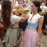 Two rented Dirndls from Versatile OTM, clients wearing Classic and Cheeky Dirndls for Oktoberfest ready to rent for the beer tent. 