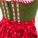 Detail of green Apple of My Eye Dirndl bodice with heart ribbons, front zip and red apron bow