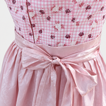 Detail of pink gingham Berwin & Wolff bodice with rose motifs and lustrous pink apron bow